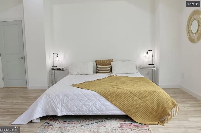 bedroom with light hardwood / wood-style floors