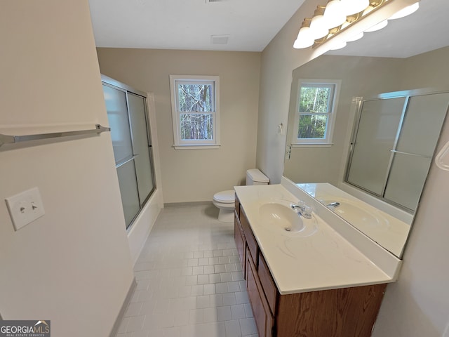 bathroom featuring vanity, tile floors, and toilet