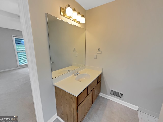 bathroom featuring tile floors and vanity with extensive cabinet space