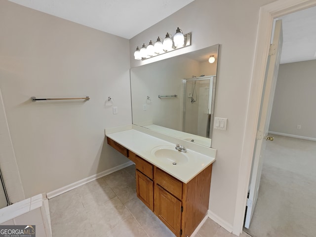 bathroom featuring vanity, tile floors, and a shower with shower door