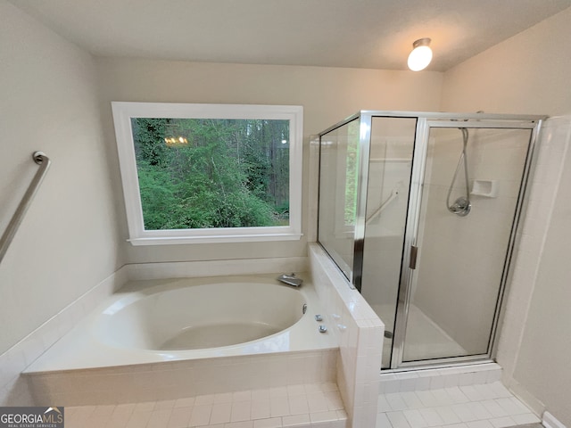 bathroom featuring plus walk in shower