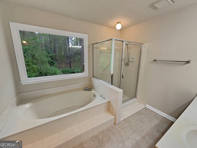 bathroom with tile floors and plus walk in shower