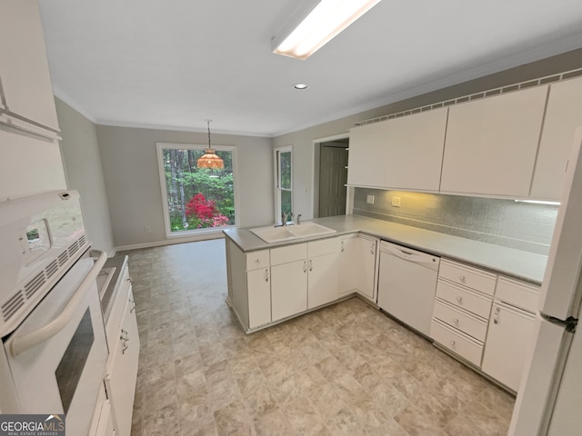 kitchen featuring white appliances, white cabinetry, backsplash, kitchen peninsula, and light tile floors