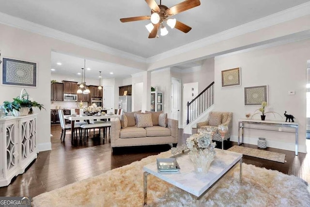 living room featuring crown molding, dark hardwood / wood-style flooring, and ceiling fan