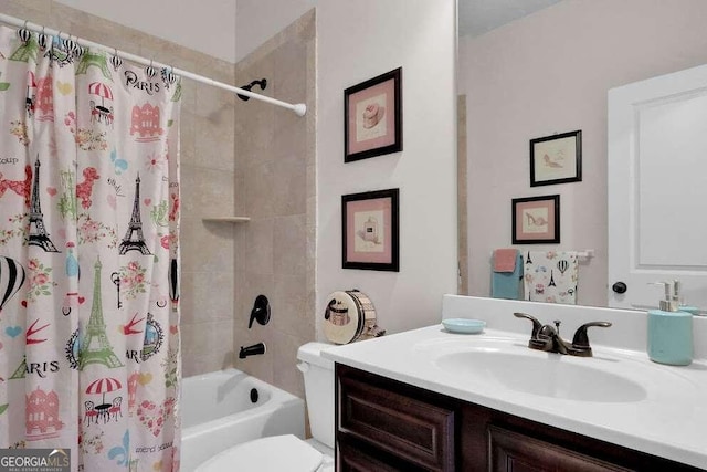 full bathroom featuring shower / bath combo with shower curtain, toilet, and vanity