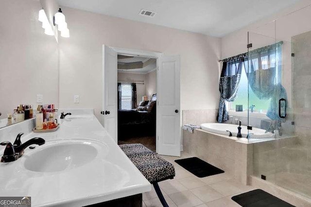 bathroom featuring dual bowl vanity, tile floors, and shower with separate bathtub