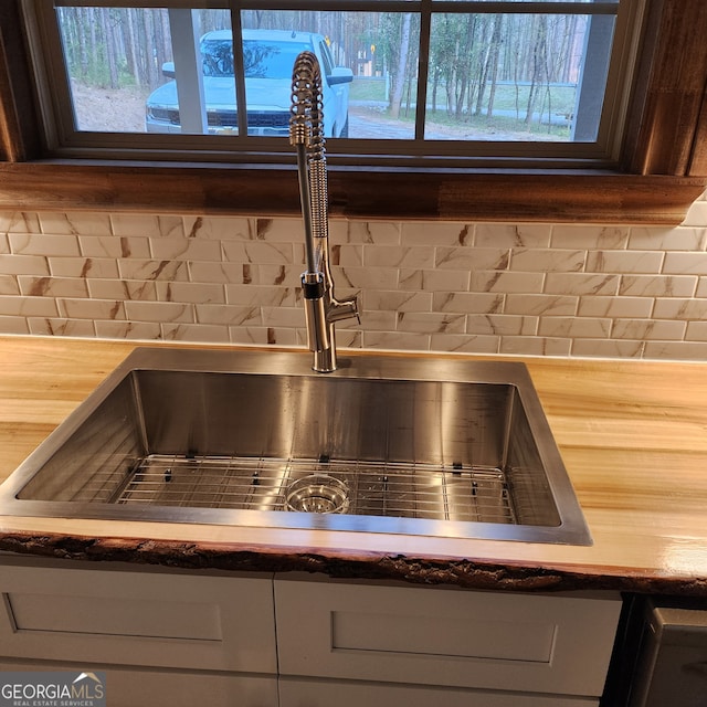 interior details with backsplash and sink