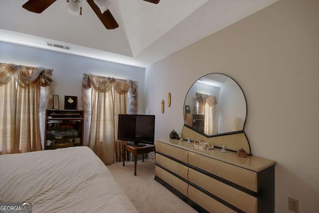 bedroom featuring ceiling fan, light colored carpet, and lofted ceiling