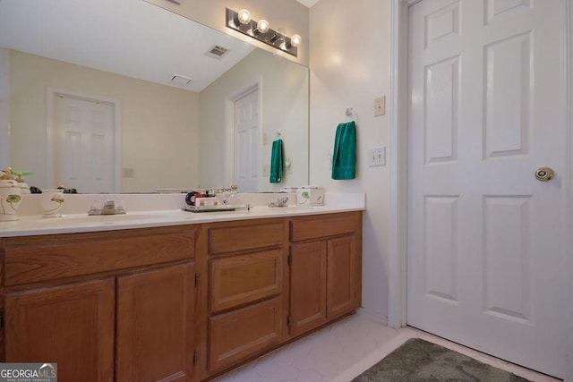 bathroom with vanity and tile patterned floors