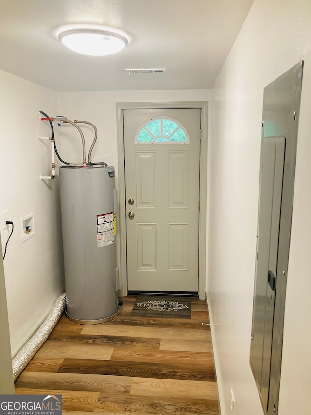 entryway featuring dark hardwood / wood-style floors and water heater