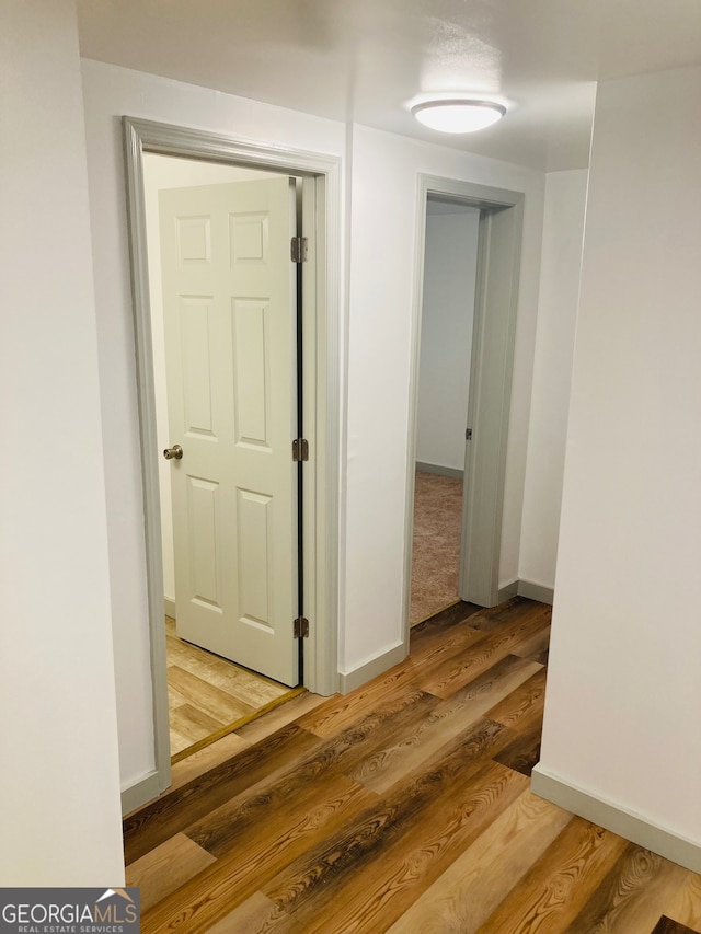 hall with light hardwood / wood-style floors