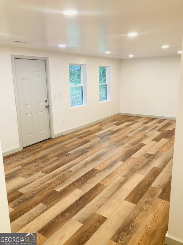 empty room with light wood-type flooring