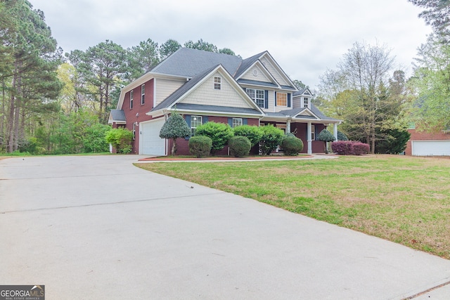 view of front of house featuring a front yard and a garage