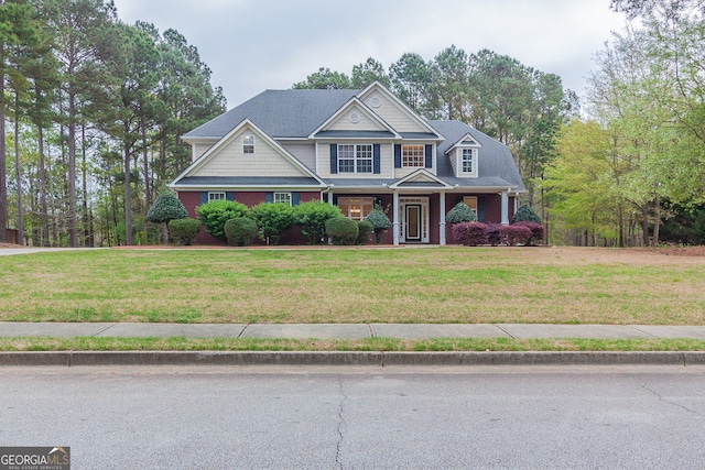 craftsman-style house with a front yard