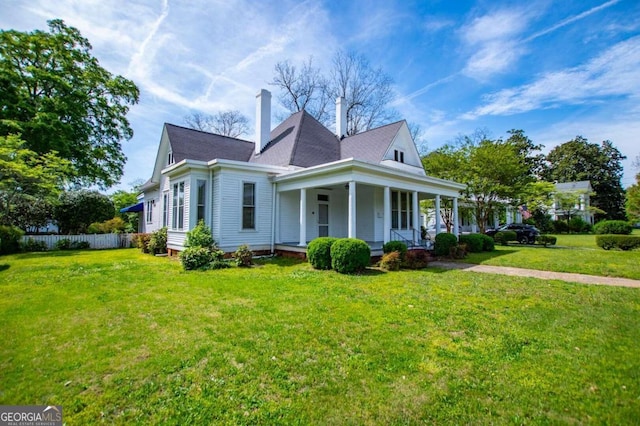 view of front facade with a porch and a front yard