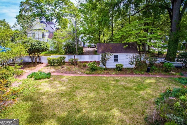 315 Dixie St, Carrollton, GA 30117 - view of yard featuring an outdoor structure and fence