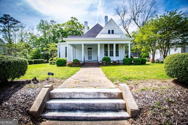 view of front of property with a porch and a front yard