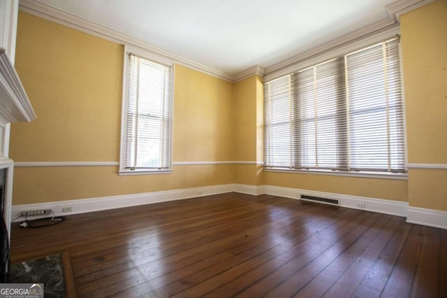 315 Dixie St, Carrollton, GA 30117 - unfurnished room with visible vents, baseboards, crown molding, and dark wood finished floors