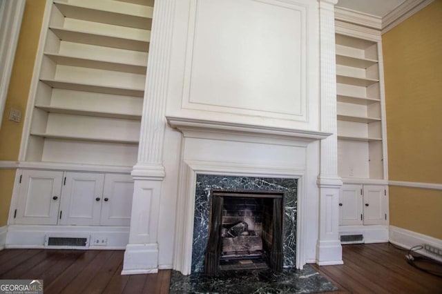 315 Dixie St, Carrollton, GA 30117 - interior details featuring crown molding, visible vents, a premium fireplace, and wood finished floors