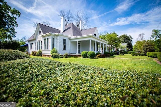 315 Dixie St, Carrollton, GA 30117 - view of property exterior with covered porch and a lawn