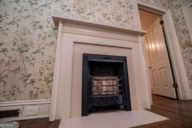 details featuring a fireplace and hardwood / wood-style flooring