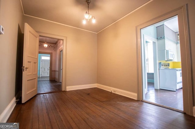 unfurnished room with crown molding and dark wood-type flooring