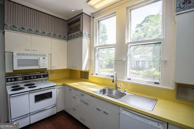 315 Dixie St, Carrollton, GA 30117 - kitchen with a wealth of natural light, light countertops, white appliances, and brick patterned floor