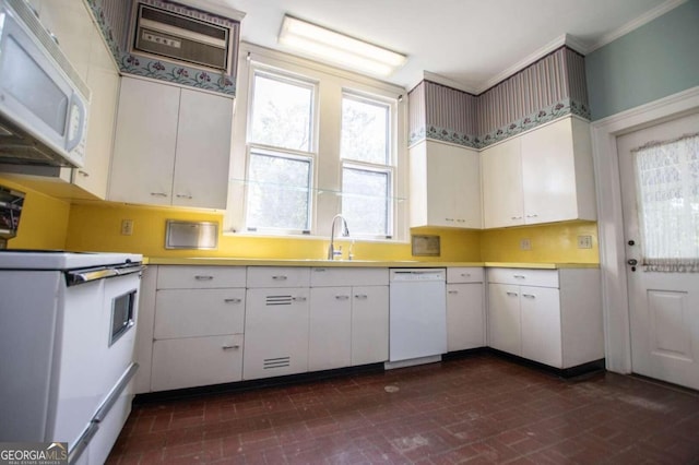 kitchen featuring white cabinetry, crown molding, white appliances, and sink