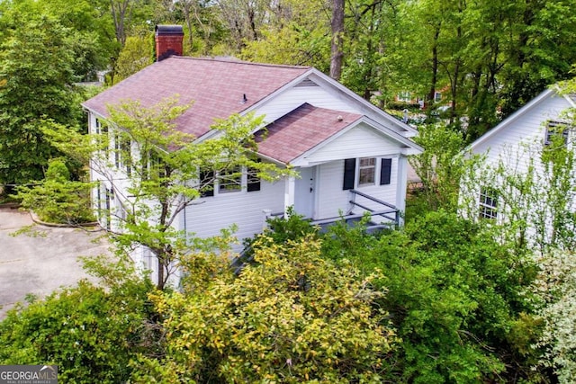 315 Dixie St, Carrollton, GA 30117 - view of front of house with roof with shingles and a chimney