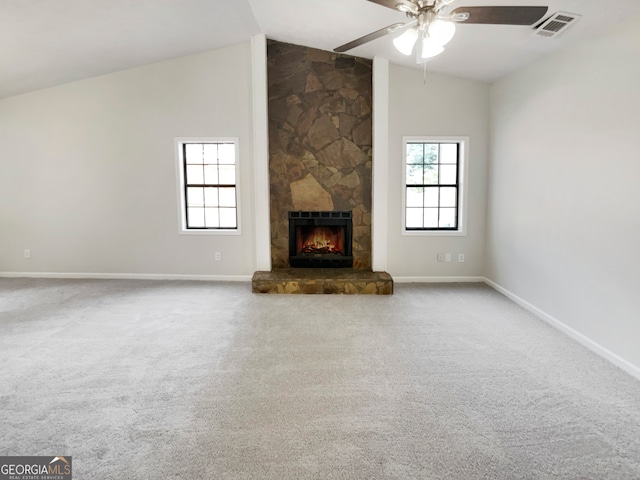 unfurnished living room featuring a fireplace, high vaulted ceiling, ceiling fan, and carpet