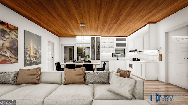 living room featuring wooden ceiling, light hardwood / wood-style flooring, and sink