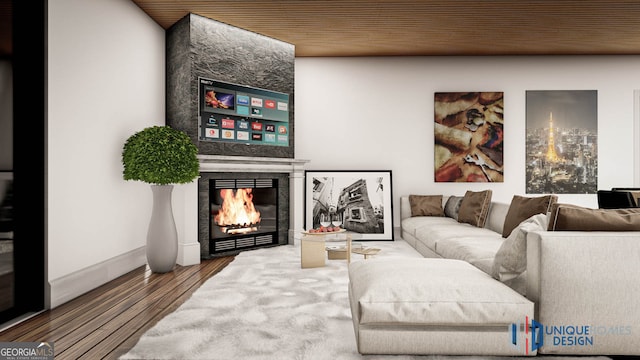 living room featuring wood-type flooring, a tile fireplace, and wooden ceiling