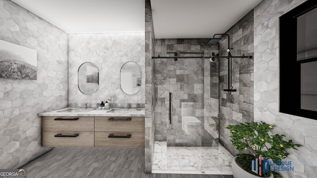 bathroom featuring dual bowl vanity, an enclosed shower, wood-type flooring, and tile walls