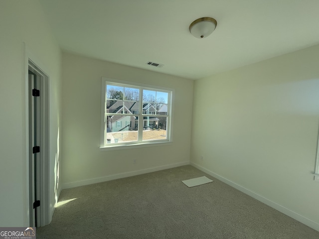 view of carpeted spare room