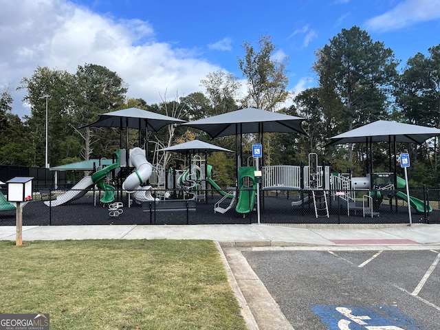 view of playground featuring a lawn