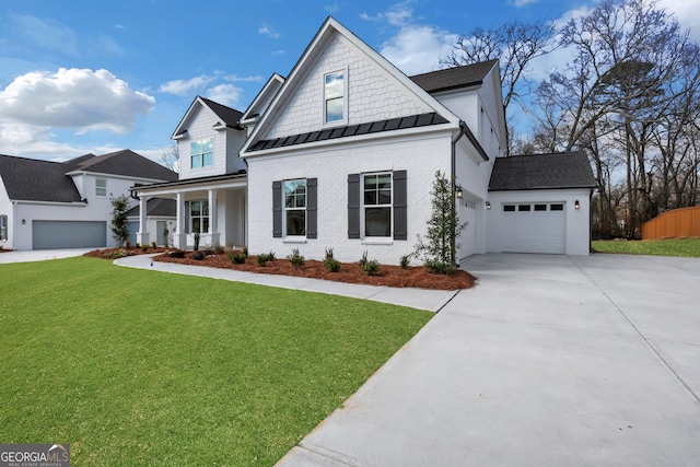 view of front facade featuring a garage, driveway, a porch, a standing seam roof, and a front lawn