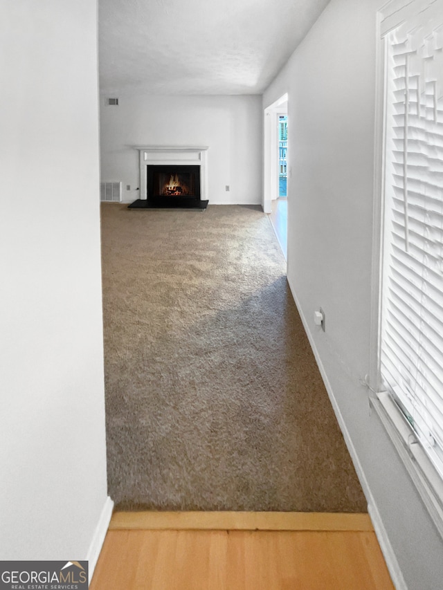 unfurnished living room featuring hardwood / wood-style flooring