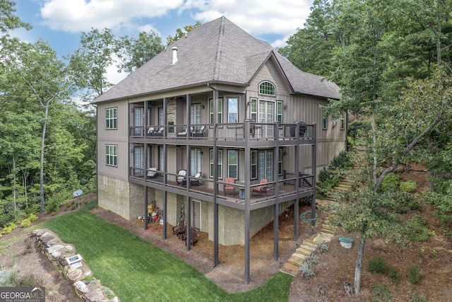 back of property featuring a wooden deck