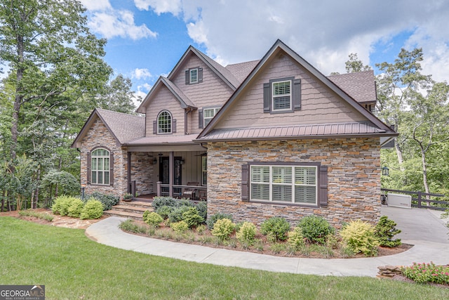 craftsman-style house with a porch and a front lawn