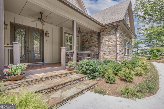 view of exterior entry with ceiling fan and covered porch