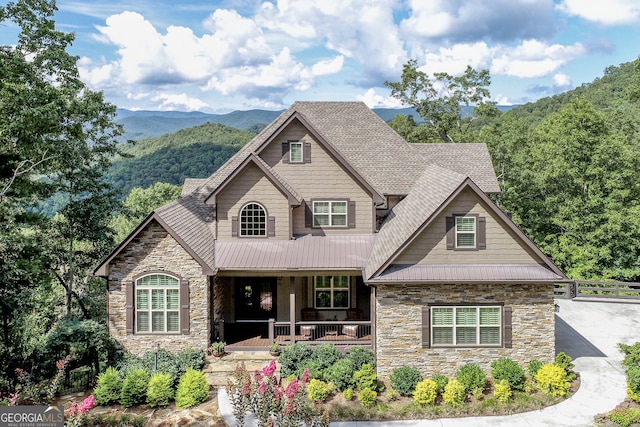 craftsman-style house with a porch and a mountain view