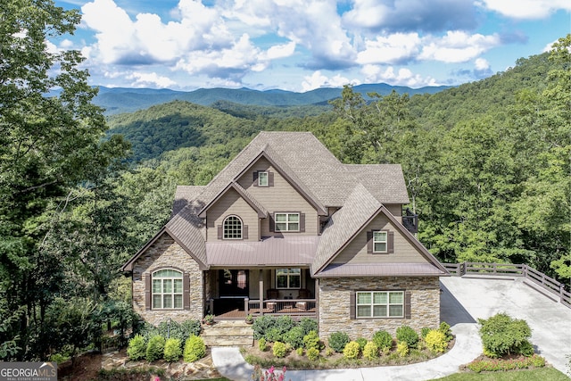 craftsman-style home with a mountain view and covered porch