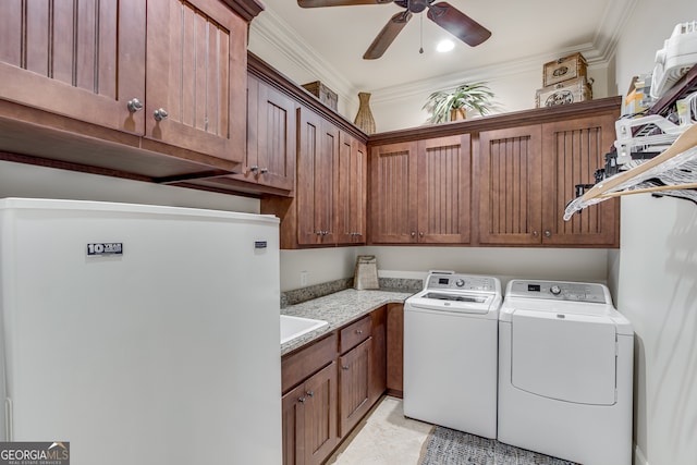 laundry area featuring ceiling fan, separate washer and dryer, light tile floors, and ornamental molding