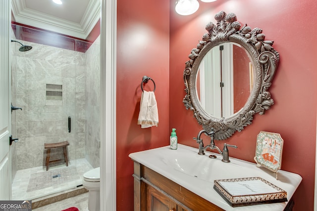 bathroom with ornamental molding, a shower with door, toilet, and vanity