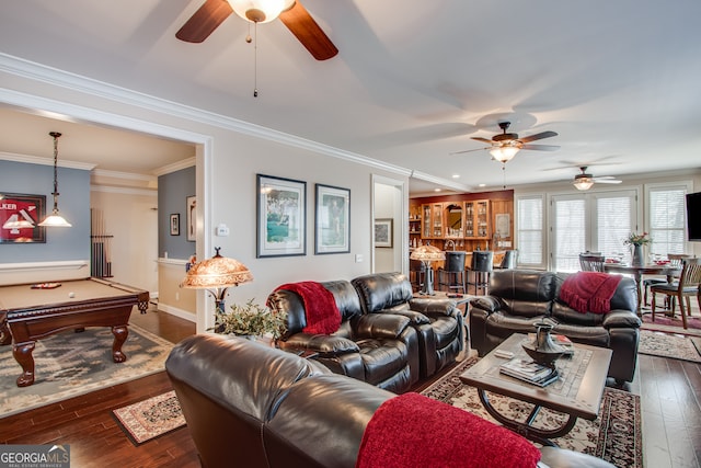 living room with ceiling fan, pool table, crown molding, and dark hardwood / wood-style flooring