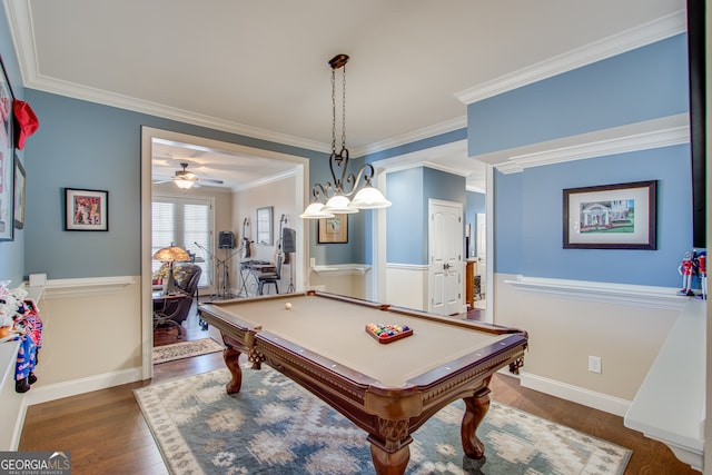 recreation room with ceiling fan, billiards, dark hardwood / wood-style flooring, and crown molding