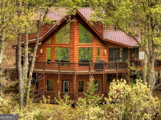 rear view of property featuring a balcony