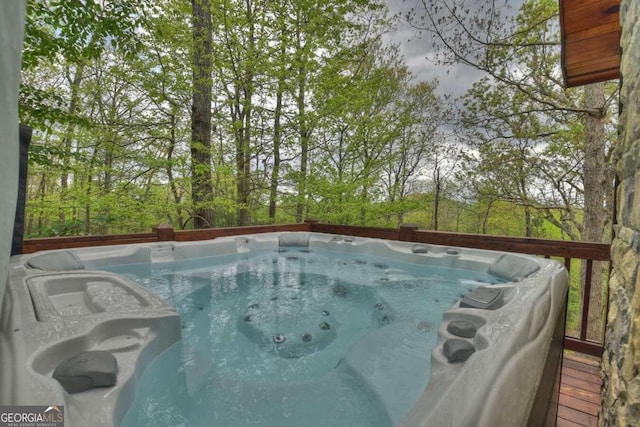 view of pool featuring an outdoor hot tub