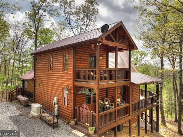 back of house featuring central AC unit