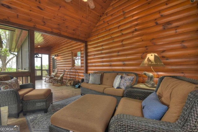 living room with high vaulted ceiling, rustic walls, wooden ceiling, hardwood / wood-style flooring, and ceiling fan